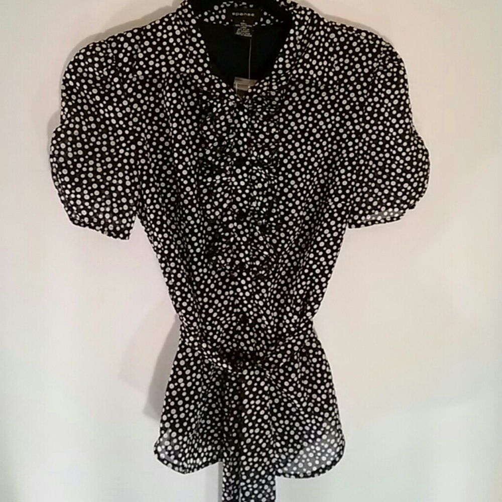 Black and white polka dot blouse.